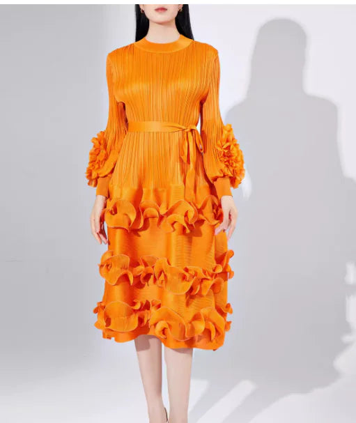 Orange dress with ruffled layers on a white background