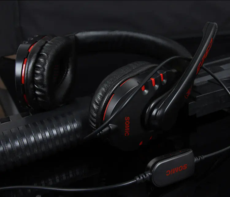 Black headphones with red accents on a dark background