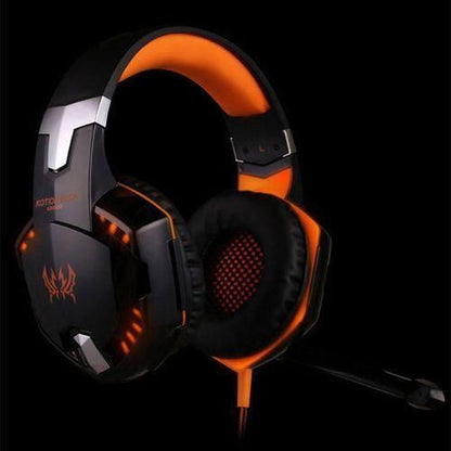 Black and orange gaming headset with microphone on a black background