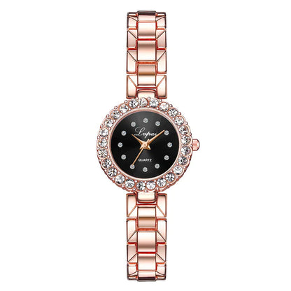 Rose gold watch with black dial on a white background
