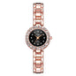 Rose gold watch with black dial on a white background