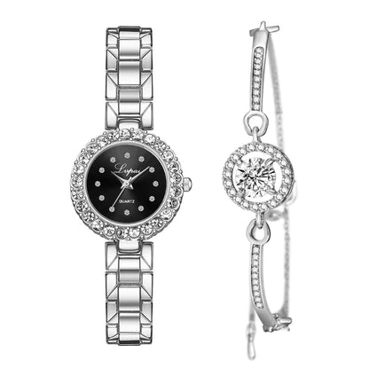 Silver watch and earrings set on a white background