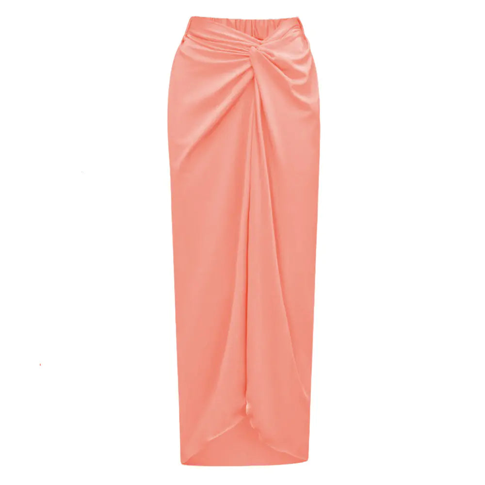 Coral pink satin skirt on a white background